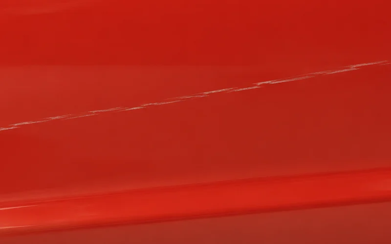 Close crop of a segment of the same pale mark; the image does not establish its depth.