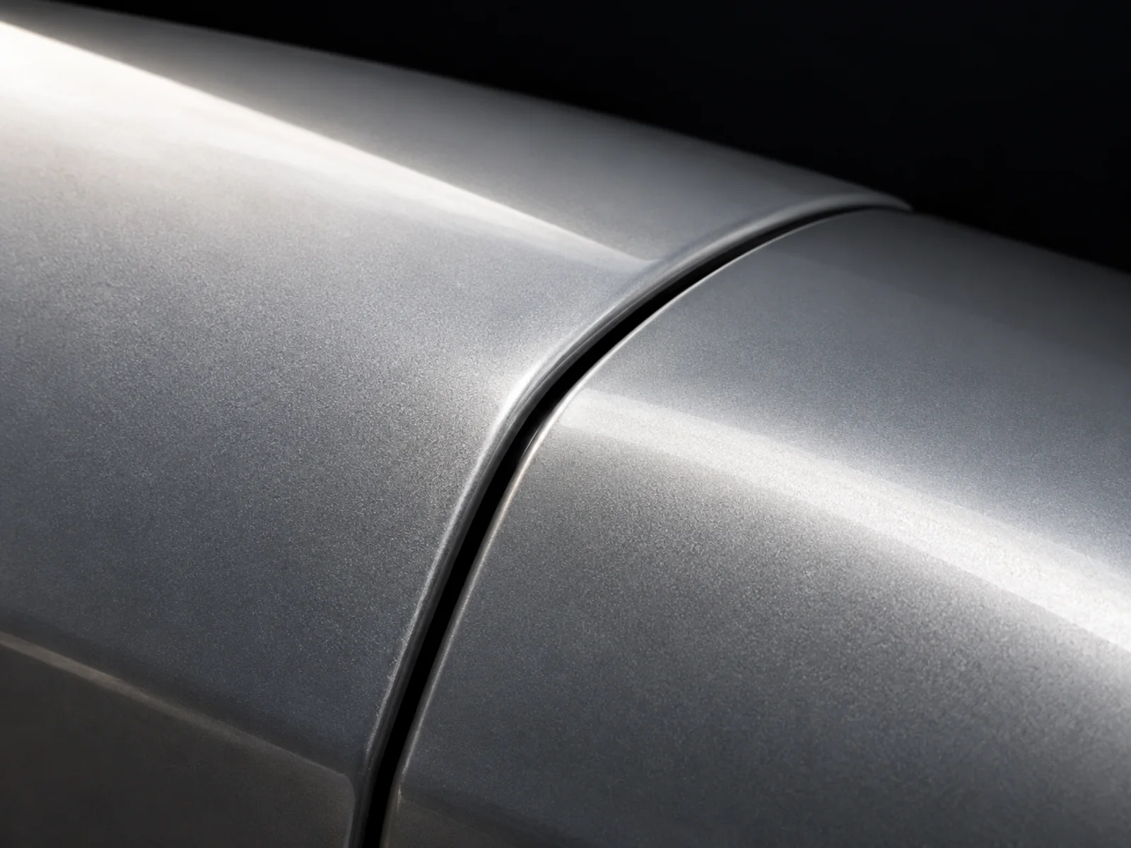 Conceptual close view of adjoining silver panel edges and their dark seam