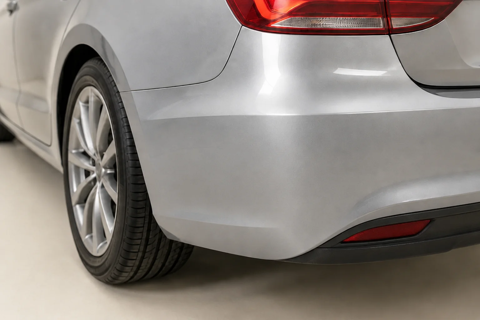 The same silver bumper corner with a smooth refinished surface